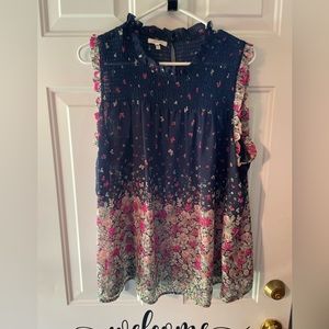 Sheer sleeveless floral blouse